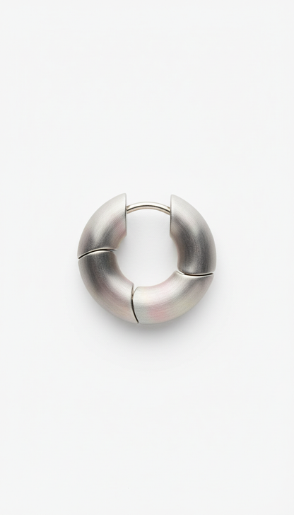 Brushed steel modular hoop earrings, Default: 3/4 angle with product elevated on matte geometric prop (block or arch) in...