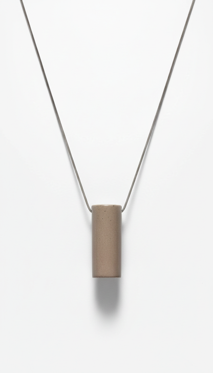 Urban taupe minimalist pendant necklace, Default: 3/4 angle shots on stone beige or muted steel textured surfaces for...