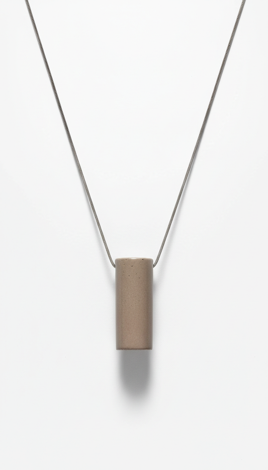 Urban taupe minimalist pendant necklace, Default: 3/4 angle shots on stone beige or muted steel textured surfaces for...